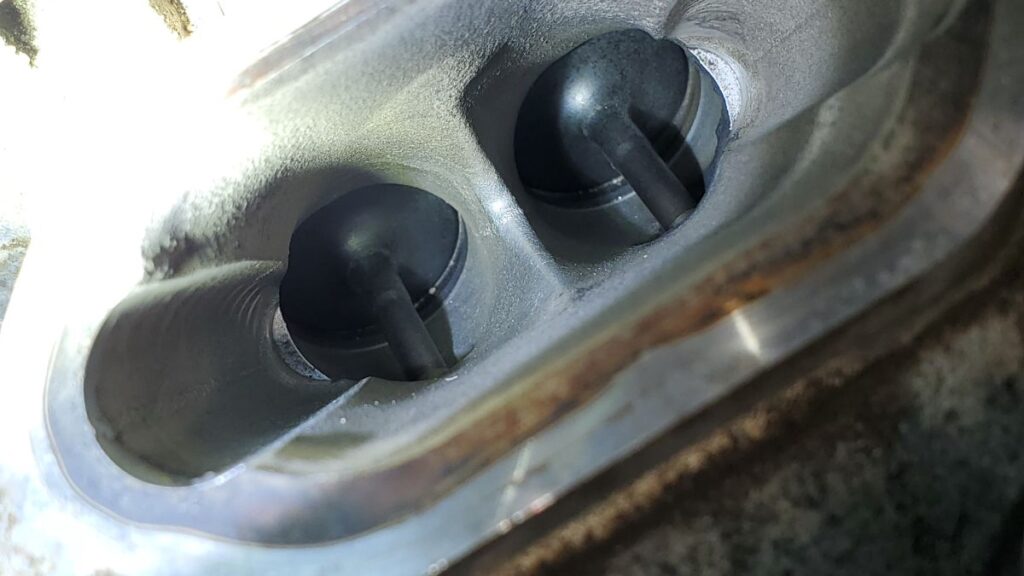 A GDI engine intake that has undergone walnut blasting, and has no visible carbon deposits