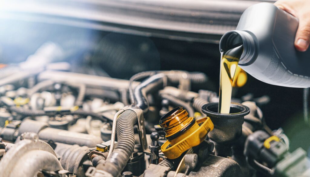 Pouring new oil into a car engine